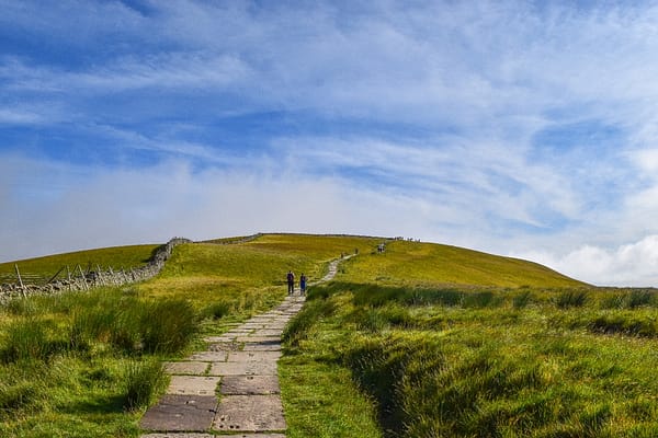 A man-made stone path leading the way uphill towards Pen-y-ghent, the beginning of the Yorkshire 3 peaks challenge.