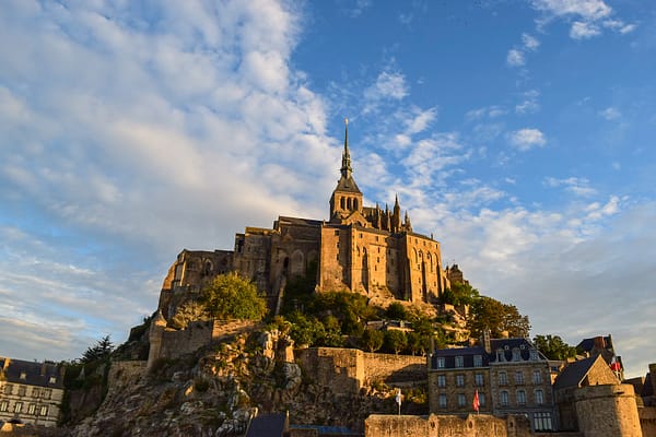 Warm sunset light on Mont Saint-Michel in France.