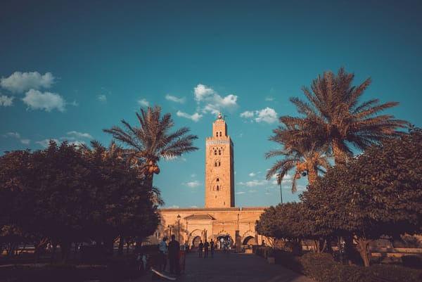 Koutoubia Zakaria Zayane Unsplash Palm trees either side of Koutoubia Mosque in Marrakech.